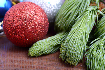 Image showing Decorated christmas tree - holiday background, green tree eve branch close up with christmas balls 