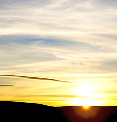 Image showing sunrise in the colored sky white soft clouds and abstract backgr