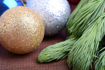 Image showing Decorated christmas tree - holiday background, green tree eve branch close up with christmas balls 