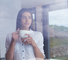 Image showing beautiful young woman drink first morning coffee