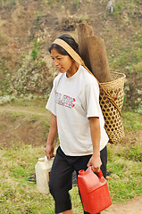 Image showing Young woman carrying load in Nagaland, India