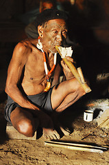 Image showing Elder man smoking pipe in Nagaland, India