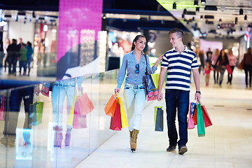 Image showing young couple with shipping bags