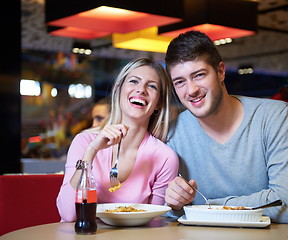 Image showing couple having lunch break in shopping mall