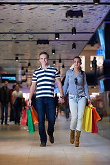 Image showing young couple with shipping bags