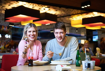 Image showing couple having lunch break in shopping mall