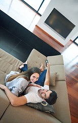 Image showing young couple watching tv at home