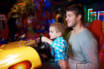 Image showing father and son playing game in playground