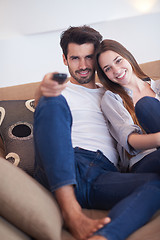 Image showing young couple watching tv at home