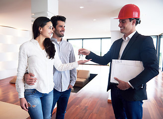 Image showing couple buying new home with real estate agent