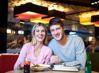 Image showing couple having lunch break in shopping mall