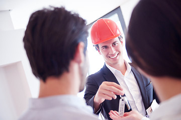 Image showing couple buying new home with real estate agent