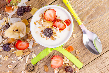 Image showing yogurt with cereals muesli and fresh strawberries