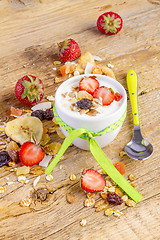 Image showing yogurt with cereals muesli and fresh strawberries