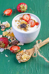 Image showing yogurt with cereals muesli and fresh strawberries