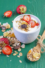 Image showing yogurt with cereals muesli and fresh strawberries