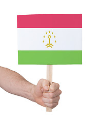 Image showing Hand holding small card - Flag of Tajikistan