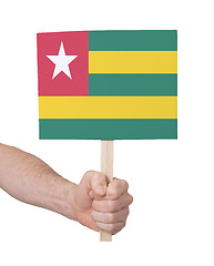 Image showing Hand holding small card - Flag of Togo