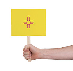 Image showing Hand holding small card - Flag of New Mexico