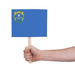 Image showing Hand holding small card - Flag of Nevada