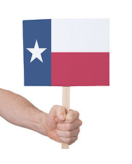 Image showing Hand holding small card - Flag of Texas