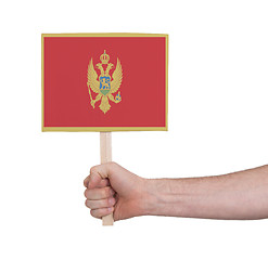 Image showing Hand holding small card - Flag of Montenegro