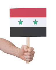 Image showing Hand holding small card - Flag of Syria