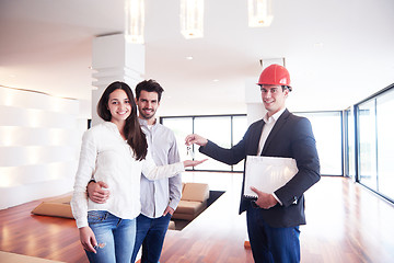 Image showing couple buying new home with real estate agent