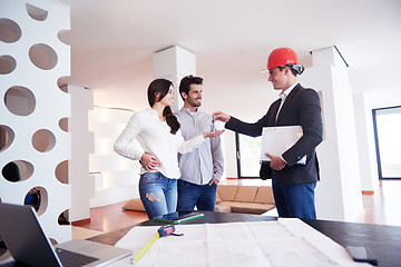 Image showing couple buying new home with real estate agent