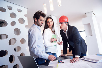 Image showing couple buying new home with real estate agent