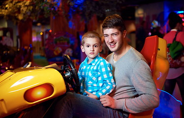 Image showing father and son playing game in playground