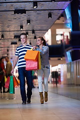 Image showing young couple with shipping bags