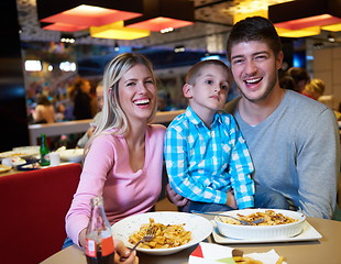Image showing family having lunch in shopping mall