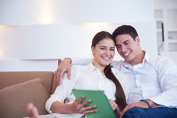 Image showing couple at modern home using tablet computer