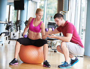 Image showing young sporty woman with trainer exercise weights lifting