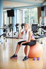 Image showing woman in fitness gym drink water