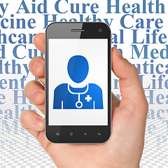 Image showing Healthcare concept: Hand Holding Smartphone with Doctor on display