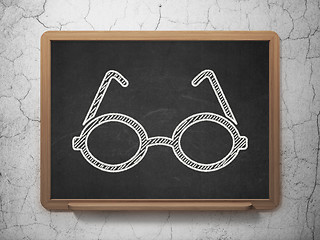 Image showing Learning concept: Glasses on chalkboard background