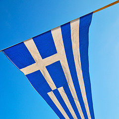 Image showing waving greece flag in the blue sky and flagpole