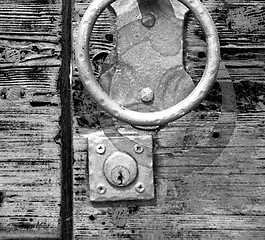 Image showing europe old in  italy  antique close brown door and rusty lock  c