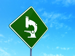 Image showing Science concept: Microscope on road sign background