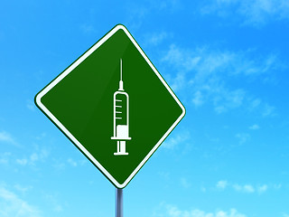 Image showing Medicine concept: Syringe on road sign background