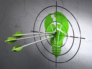 Image showing Business concept: arrows in Light Bulb target on wall background