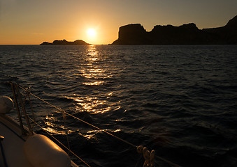 Image showing Sunset, sea and sailing boat