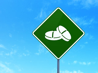 Image showing Medicine concept: Pills on road sign background