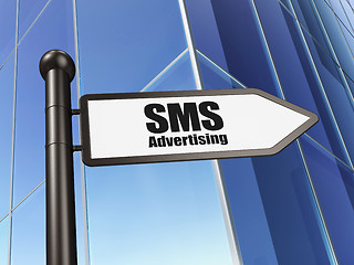 Image showing Marketing concept: sign SMS Advertising on Building background