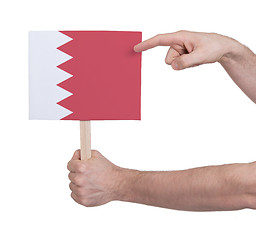 Image showing Hand holding small card - Flag of Bahrain