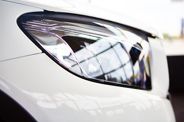 Image showing Detail on the headlight of car