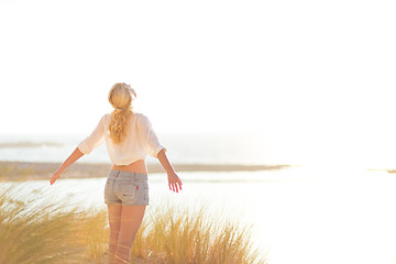 Image showing Free Happy Woman Enjoying Sun on Vacations.