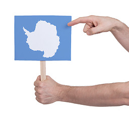 Image showing Hand holding small card - Flag of Antarctica